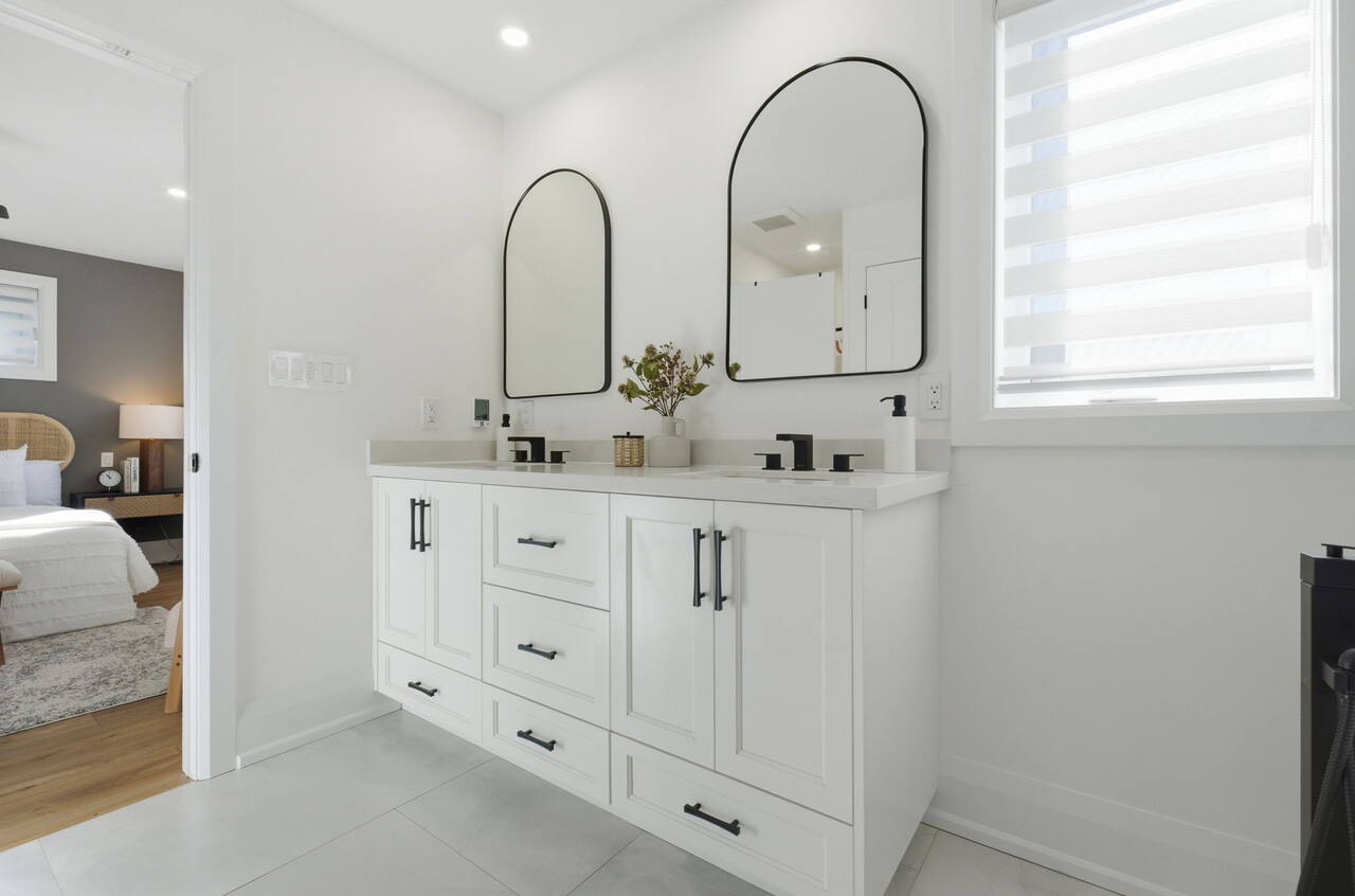 Double vanity with arch mirrors