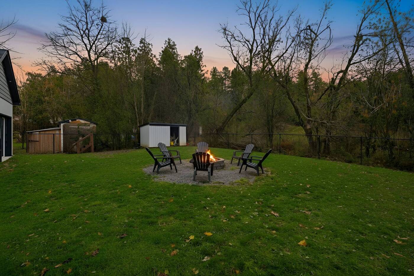Fire pit and backyard at dusk